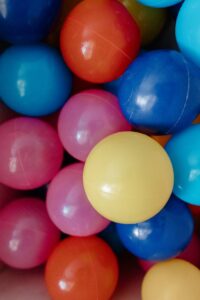 Vibrant close-up of colorful plastic balls in a ball pit.