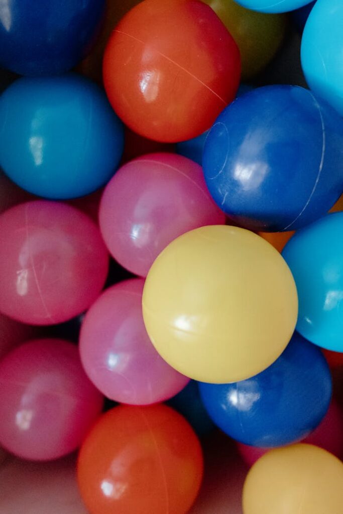 Vibrant close-up of colorful plastic balls in a ball pit.